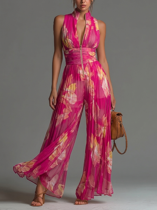 Gerda | Ærmeløs buksedragt i plisseret chiffon med fuchsia blomsterprint